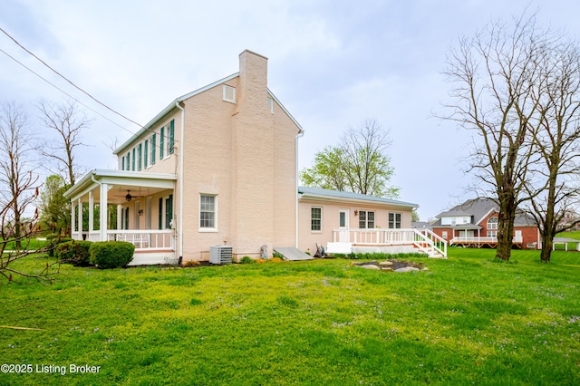 2990 Cedar Grove Rd, Shepherdsville, KY 40165 - back of house with ceiling fan, a chimney, a yard, a wooden deck, and covered porch