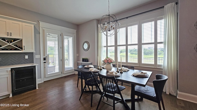 6015 St Bernadette Ave, Prospect, KY 40059 - dining area featuring wine cooler, a chandelier, dark wood-type flooring, and a bar