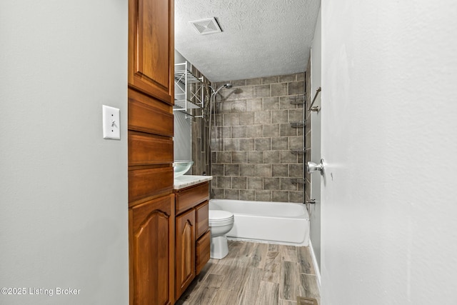 3619 Endeavor Way, Louisville, KY 40219 - full bathroom with bathing tub / shower combination, wood finished floors, vanity, and a textured ceiling