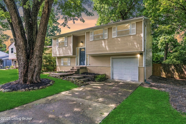3619 Endeavor Way, Louisville, KY 40219 - bi-level home featuring a garage and concrete driveway