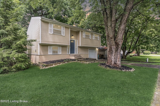3619 Endeavor Way, Louisville, KY 40219 - raised ranch featuring a garage, a front yard, and view of wooded area