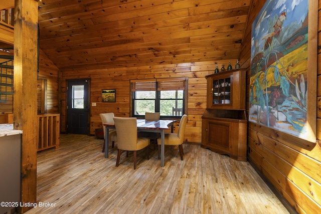 1946 Drane Ln, Eminence, KY 40019 - dining space with light wood-type flooring, lofted ceiling, wooden walls, and wooden ceiling