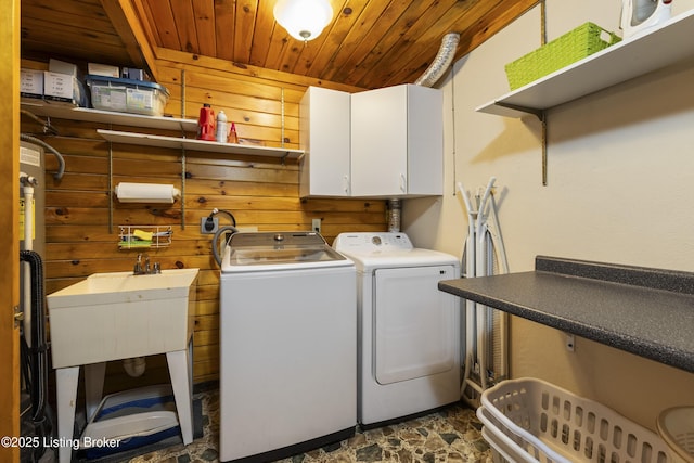 1946 Drane Ln, Eminence, KY 40019 - laundry area with wooden ceiling, washing machine and dryer, cabinet space, dark stone finish floors, and wooden walls