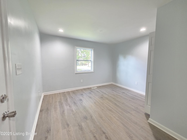 342 E Southside Ct, Louisville, KY 40214 - spare room with wood finished floors and recessed lighting