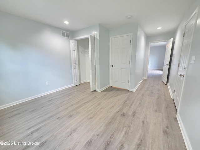 342 E Southside Ct, Louisville, KY 40214 - unfurnished bedroom featuring recessed lighting, light wood-style floors, and a closet