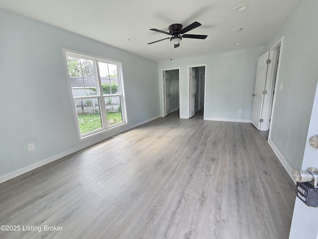 342 E Southside Ct, Louisville, KY 40214 - unfurnished bedroom featuring wood finished floors and ceiling fan