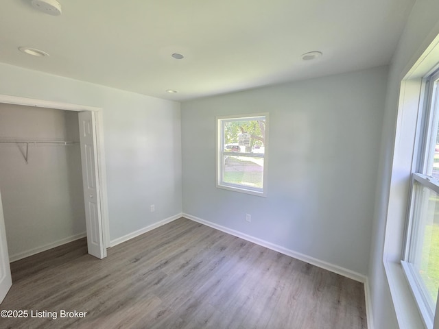342 E Southside Ct, Louisville, KY 40214 - unfurnished bedroom with wood finished floors and a closet