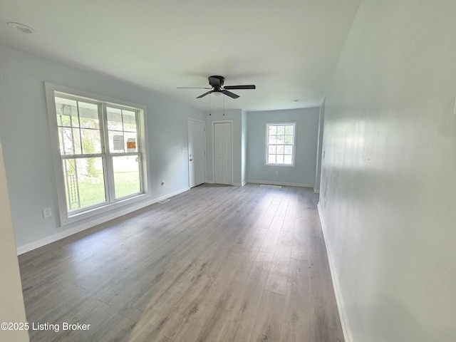 342 E Southside Ct, Louisville, KY 40214 - unfurnished living room featuring wood finished floors and ceiling fan