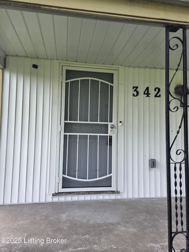 342 E Southside Ct, Louisville, KY 40214 - property entrance featuring board and batten siding