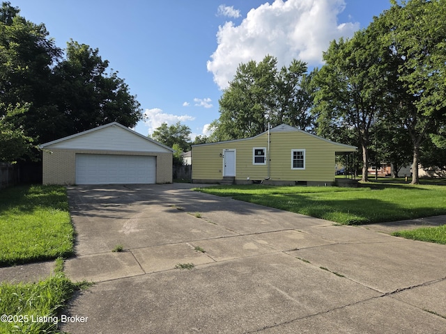 342 E Southside Ct, Louisville, KY 40214 - view of front of house featuring an outbuilding, a detached garage, and a front lawn