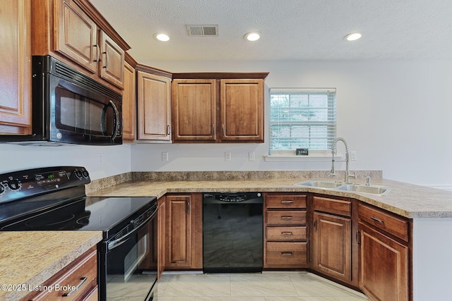 152 Glen Ridge Dr, Mt Washington, KY 40047 - kitchen featuring black appliances, recessed lighting, a peninsula, a textured ceiling, and brown cabinetry