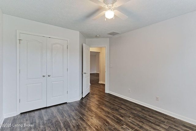152 Glen Ridge Dr, Mt Washington, KY 40047 - unfurnished bedroom featuring dark wood-type flooring, a closet, a textured ceiling, and ceiling fan