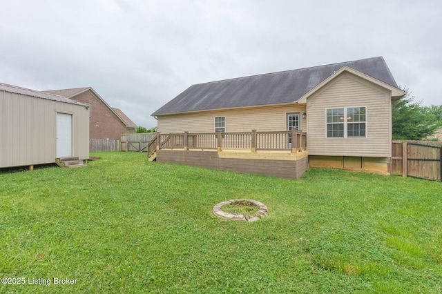 152 Glen Ridge Dr, Mt Washington, KY 40047 - back of property with a wooden deck, a fenced backyard, entry steps, and an outbuilding