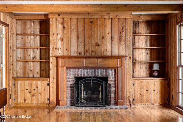 3920 Elfin Ave, Louisville, KY 40207 - detailed view of wooden walls, wood finished floors, and a brick fireplace