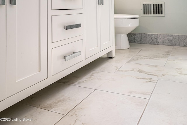 3920 Elfin Ave, Louisville, KY 40207 - bathroom featuring marble look tiles and toilet