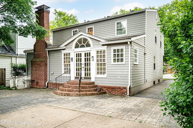3920 Elfin Ave, Louisville, KY 40207 - rear view of house with french doors, a chimney, entry steps, and a patio