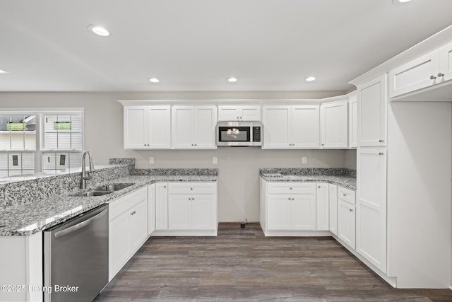 3020 Thorntree Ln, Lawrenceburg, KY 40342 - kitchen featuring appliances with stainless steel finishes, white cabinetry, light stone counters, recessed lighting, and dark wood finished floors