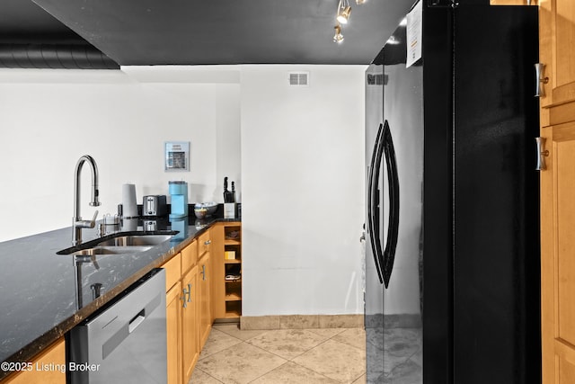 953 Baxter Ave Unit 101, Louisville, KY 40204 - kitchen with freestanding refrigerator, stainless steel dishwasher, dark stone counters, and light tile patterned floors