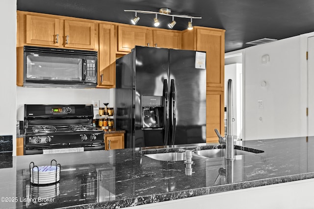 953 Baxter Ave Unit 101, Louisville, KY 40204 - kitchen with black appliances, dark stone countertops, and rail lighting