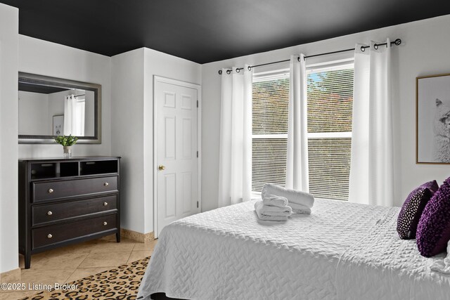953 Baxter Ave Unit 101, Louisville, KY 40204 - bedroom featuring light tile patterned floors and baseboards