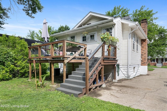 1248 Springdale Dr, Louisville, KY 40213 - back of house with a chimney, a deck, and stairs