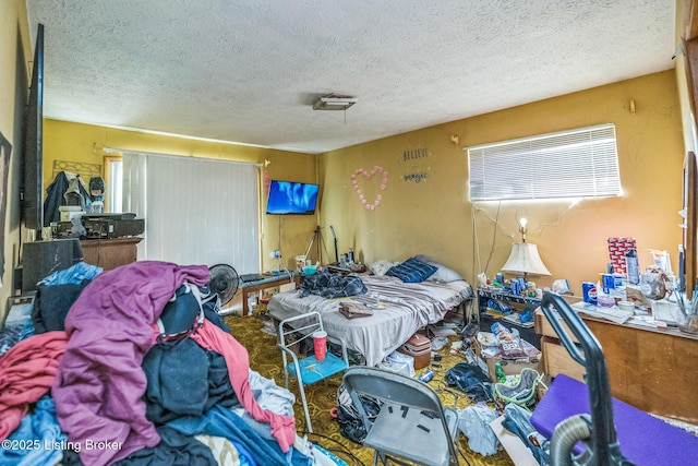 911 N Main St, Barbourville, KY 40906 - bedroom with a textured ceiling and a closet