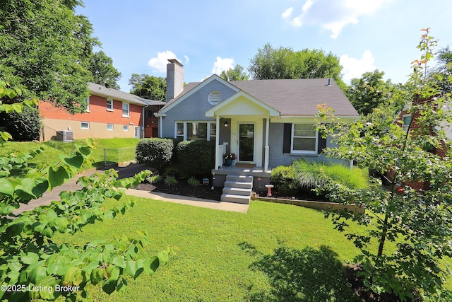 3303 Eagle Pass, Louisville, KY 40213 - view of front of home featuring a front yard, a chimney, and brick siding