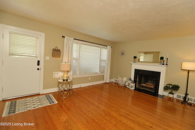 3303 Eagle Pass, Louisville, KY 40213 - unfurnished living room with a tile fireplace and wood finished floors