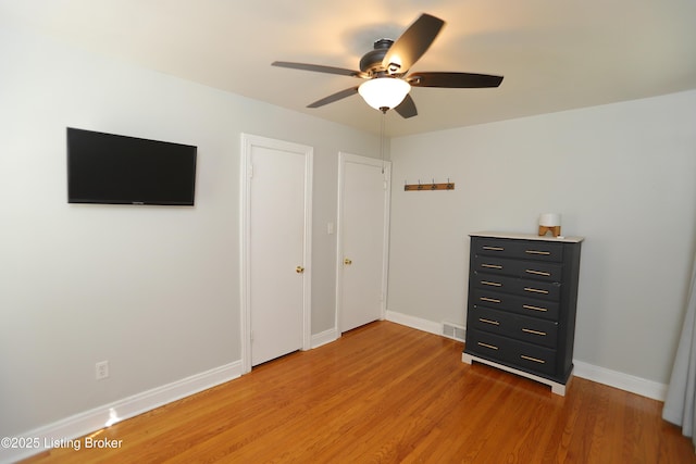3303 Eagle Pass, Louisville, KY 40213 - unfurnished bedroom with light wood finished floors and ceiling fan
