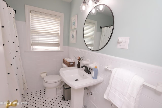 3303 Eagle Pass, Louisville, KY 40213 - bathroom featuring tile walls, a wainscoted wall, and curtained shower