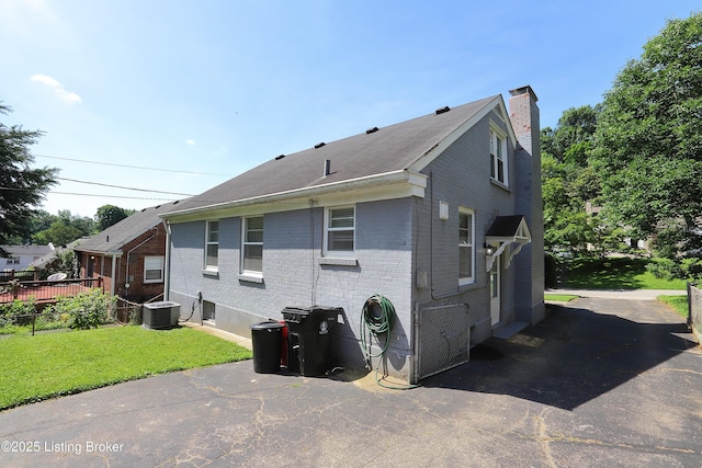 3303 Eagle Pass, Louisville, KY 40213 - view of home's exterior featuring brick siding and a chimney