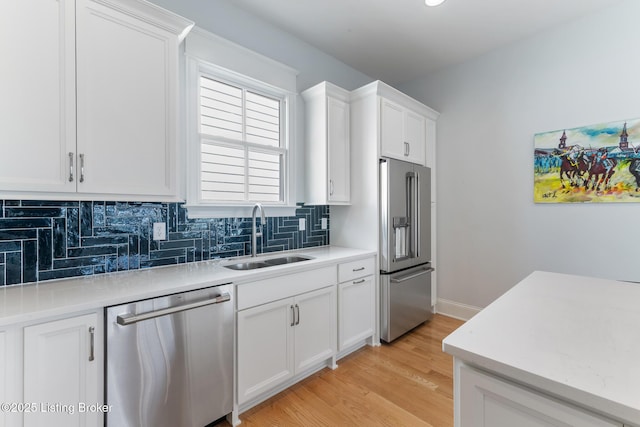 6113 St Bernadette Ave, Prospect, KY 40059 - kitchen featuring stainless steel appliances, decorative backsplash, light countertops, and white cabinets
