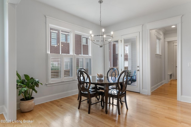 6113 St Bernadette Ave, Prospect, KY 40059 - dining area with a chandelier and light wood-type flooring