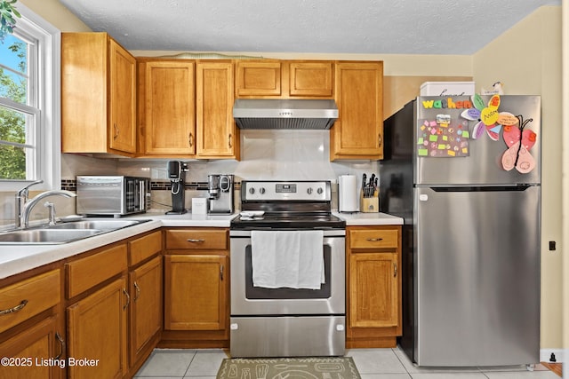 3403 Endeavor Way, Louisville, KY 40219 - kitchen featuring appliances with stainless steel finishes, extractor fan, light countertops, and a textured ceiling