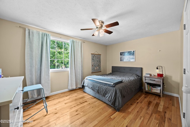 3403 Endeavor Way, Louisville, KY 40219 - bedroom featuring wood finished floors, a textured ceiling, and ceiling fan
