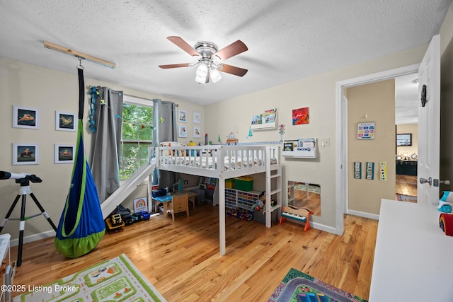 3403 Endeavor Way, Louisville, KY 40219 - bedroom with light wood finished floors and a textured ceiling
