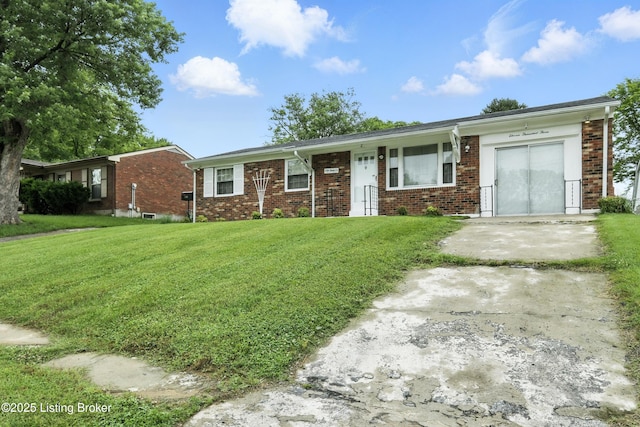 11003 Thunder Dr, Louisville, KY 40272 - ranch-style house with brick siding, a front yard, and driveway