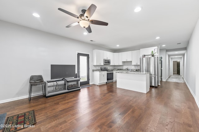 930 York St, Newport, KY 41071 - kitchen with stainless steel appliances, white cabinetry, ceiling fan, dark wood-style floors, and recessed lighting