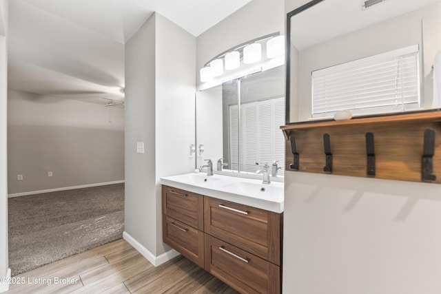 930 York St, Newport, KY 41071 - full bathroom featuring double vanity and wood finished floors