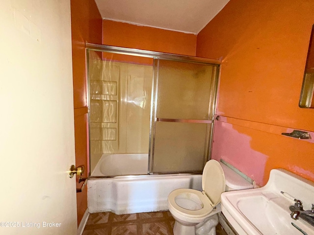 3809 Algonquin Pkwy, Louisville, KY 40211 - bathroom with toilet and combined bath / shower with glass door