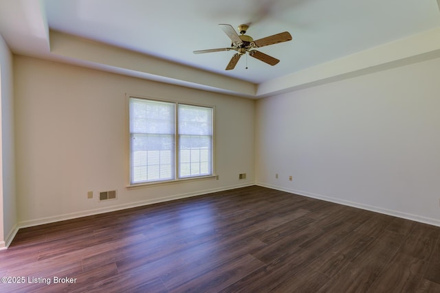 4401 Greenhaven Ln, Goshen, KY 40026 - unfurnished room with dark wood-style floors, a tray ceiling, and ceiling fan