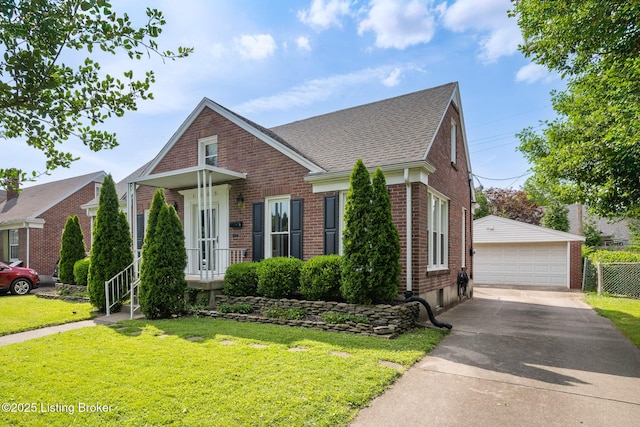1005 Rosemary Dr, Louisville, KY 40213 - view of front of property featuring brick siding, an outbuilding, a garage, a shingled roof, and a front lawn