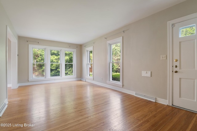 1005 Rosemary Dr, Louisville, KY 40213 - unfurnished living room featuring light wood-style floors and healthy amount of natural light