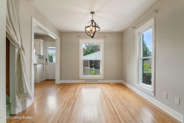 1005 Rosemary Dr, Louisville, KY 40213 - unfurnished room featuring a chandelier and light wood-type flooring