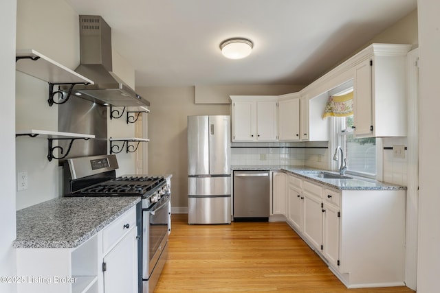 1005 Rosemary Dr, Louisville, KY 40213 - kitchen with open shelves, appliances with stainless steel finishes, white cabinetry, light wood finished floors, and decorative backsplash