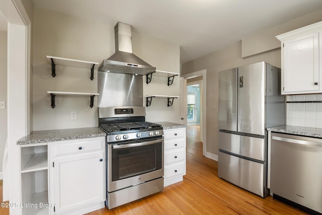 1005 Rosemary Dr, Louisville, KY 40213 - kitchen with open shelves, appliances with stainless steel finishes, wall chimney range hood, and light wood-type flooring