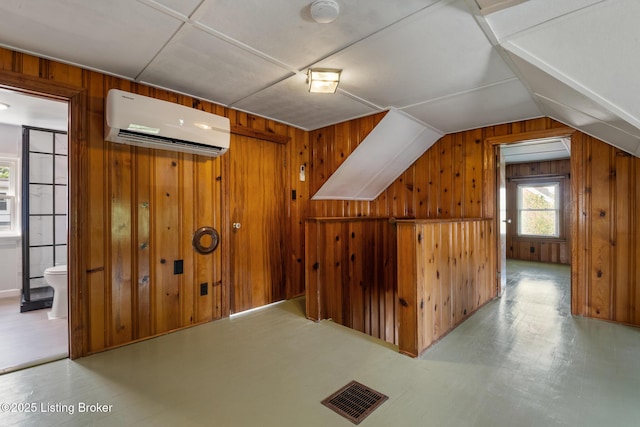 1005 Rosemary Dr, Louisville, KY 40213 - additional living space with a wall unit AC, wood walls, and lofted ceiling