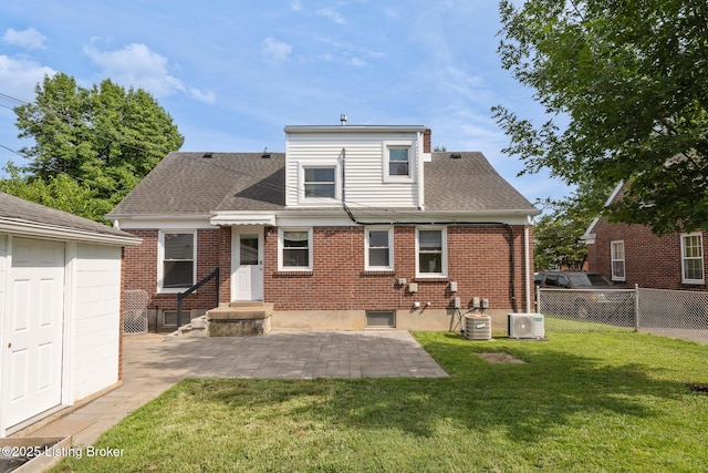 1005 Rosemary Dr, Louisville, KY 40213 - back of house featuring a patio, brick siding, roof with shingles, and an outdoor structure