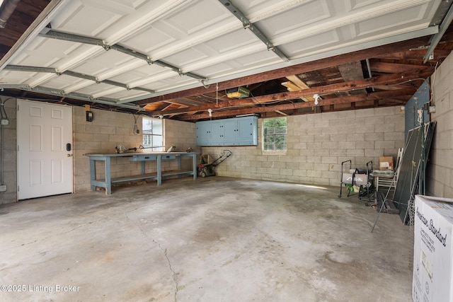 1005 Rosemary Dr, Louisville, KY 40213 - garage with concrete block wall and a garage door opener