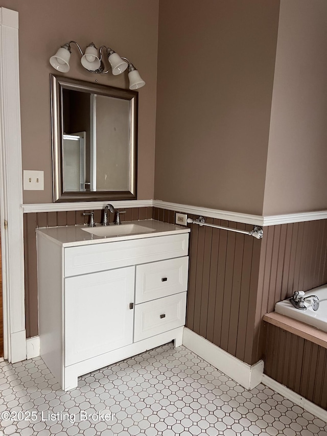 1308 S 2nd St, Louisville, KY 40208 - bathroom featuring wainscoting, vanity, a bath, and wooden walls
